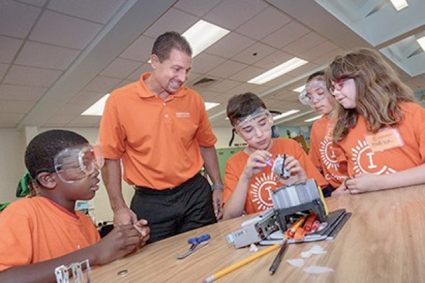 Dr. Begnini with you students working on a project